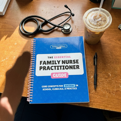 The guide open flat on a desk beside a stethoscope and iced coffee